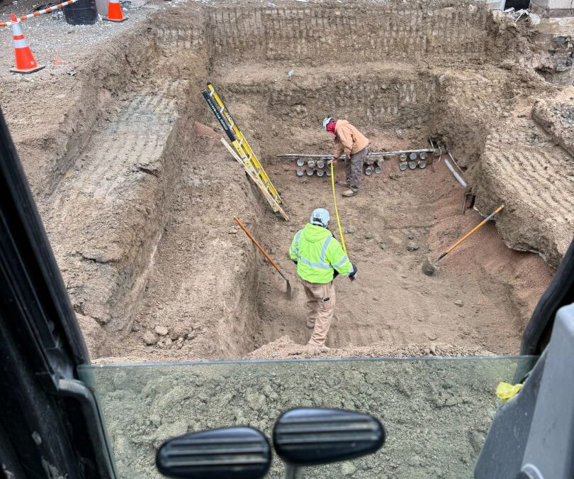 Hydro excavation equipment safely exposing underground utilities on a Colorado construction site